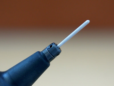 Flush setting tool for small round stones