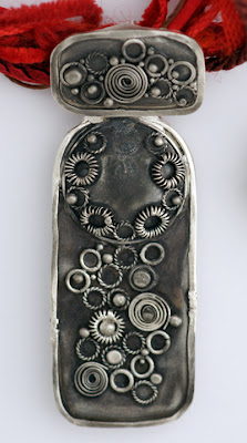 Granulation and metal clay created to look weathered and worn