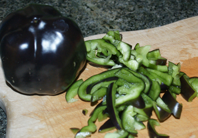 Black bell peppers: whole and cut up