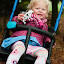 Swinging with her cow