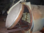 The autoclaves will shortly be shut, then slowly heated up to 152 degress. Adding a pressure of xxx atm. will induce an exothermic reaction which vulcanizes the rubber into Ebonite.