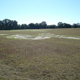 A typical closed landfill requires continuous maintenance. Here bare areas are photographed and reseeding is recommended to the owner. A typical closed landfill requires continuous maintenance. Here bare areas are photographed and reseeding is recommended to the owner.