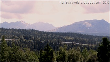 Here's a look at a stretch of line above ground along the Richardson Highway.  Where the frozen ground is well-drained gravel or solid rock, thawing is no problem, so the pipeline is underground. The vastness of the landscape seems to almost consume the line.