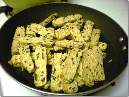 Tempeh lesson number one ( for Steve)! First cut up your tempeh how you want it and put it in a pan with about a tablespoon on olive oil.