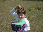 Poete Lozier displays his Easter basket after the egg hunt, Easter, 2008