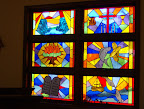 The northwest windows after the installation of new stained glass.