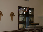 Amanda Early preparing the west side windows for installation of the stained glass.