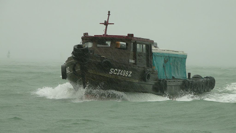 Bumboat in rain