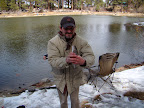My trout, not on the hook because he tried to escape.