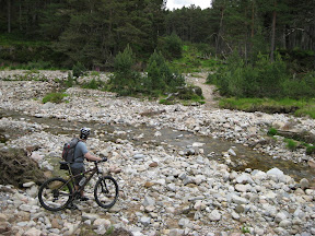 todd's trying to find the trail beyond the stream and into the forest