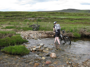 we crossed this stream about a dozen times that day.  you'll notice that my bike is already across the bank.  i had waterproof biking sandals while todd had biking shoes that were dried really slowly.  todd managed to keep his feet dry throughout the day and seeing this stream, i offered just to walk his bike across so he could try to rock-hop across the stream and stay dry.  on future days, he started bringing extra pairs of dry socks.