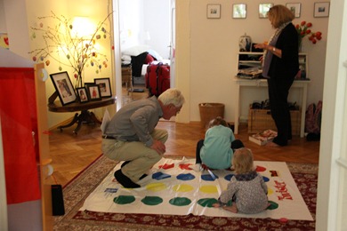 Papa playing twister with the girls in our hall.