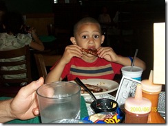 Caleb enjoying his ribs