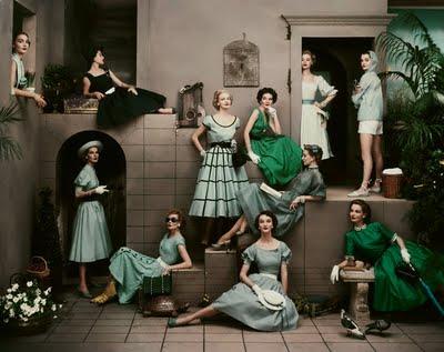 Eleven women model fashions in tones of green and blue
