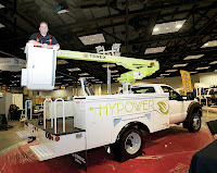 Nick Cammisa of Terex demonstrates the battery-powered,  HyPower aerial lift at Booth 5157