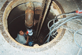 A Rainforest technician installs the new pump system. 