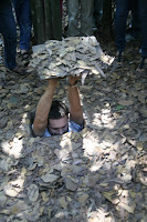 Entering my first Cu Chi tunnel... tight squeeze, and surprisingly not a tunnel without choices...