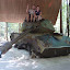 Sitting proud on an American M41 tank, destroyed in landmine in 1970. Also a geocache!