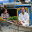 A more relaxed pair of grandparents, complete with pot plant, soaking up the scene.