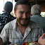 On my right, some crispy spring rolls. On my left, Mi Quang. In the middle, a big smile.