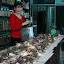 Inside an alternative therapy shop, a prescription is being made ready for a waiting patient.
