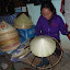 A local demonstration of the ubiquitous conical hats, which are amazingly enough available to buy there and then.