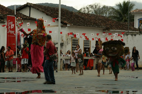 These crazy characters were running around a large playground to drums, basically scaring little children.