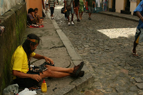 Lots of street sellers, this guy was making shoes from a variety of materials including car tyres for the soles!