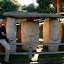 Smiley Steve in front of not smiley statues