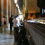 On one side of the Buddha's room, people drop coins into each and every pot in a long line, the constant clicking sounding almost musical as it echoes around the room.