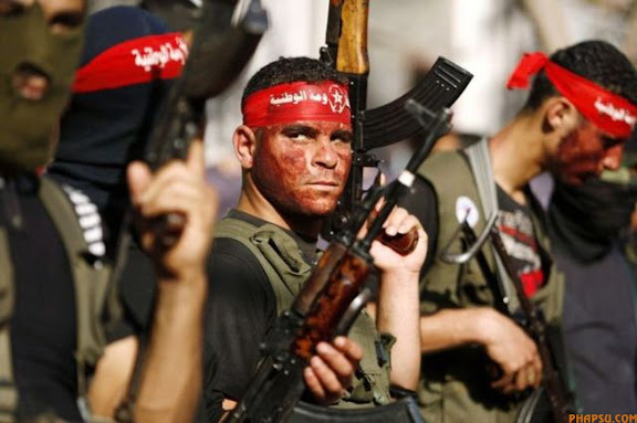 RNPS IMAGES OF THE YEAR 2009 - Palestinian militants march during a rally organized by the Democratic Front for the Liberation of Palestine (DFLP) in al-Buraij refugee camp in Gaza Strip May 23, 2009. REUTERS/Ibraheem Abu Mustafa (GAZA IMAGES OF THE DAY CONFLICT)