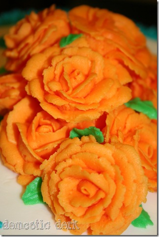 orange Wilton cake decorating class rose