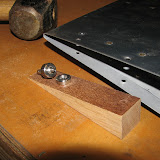 I was able to dimple these #30 holes in the trailing edge of the rudder by using a standard dimple die, paired with a pop rivet dimple die, a little hardwood wedge, and a couple taps from the sledge hammer.  The results are almost as good as those done with a rivet squeezer.