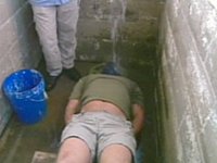 Man being waterboarded