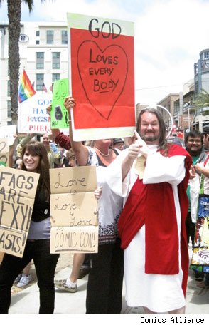 Jesus costume and GOD LOVES EVERYBODY sign