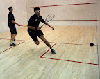 Co-Captain, Jim Bristow (R) sends Santiago Imberston (P) to the back corner on his way to a win at the #3 position