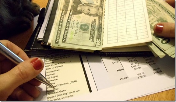 Put money in envelopes according to budget