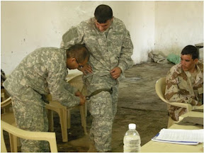 Spc. Manuel Figueroa of Battery A, 2nd Battalion 29th Field Artillery Regiment instructs 2nd Bn, 41st Iraqi Army Brigade medics on the proper use of tourniquets during first-responder training. Figueroa is a healthcare specialist from El Paso, Texas deployed with 4th Brigade Combat Team, 1st Armored Division. (Courtesy photo)