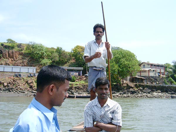 Boatman taking passengers to the other side, towards Kade Varcha Ganpati Temple Boatman taking passengers to the other side, towards Kade Varcha Ganpati Temple