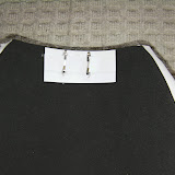 Hooks on shoulder armor to attach to the chest straps