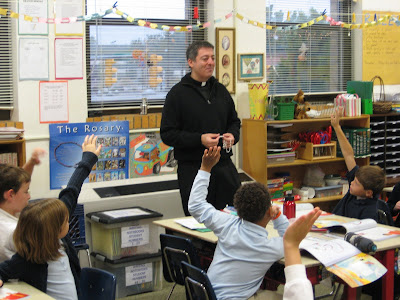 Fr. John teaches a lesson about the rosary