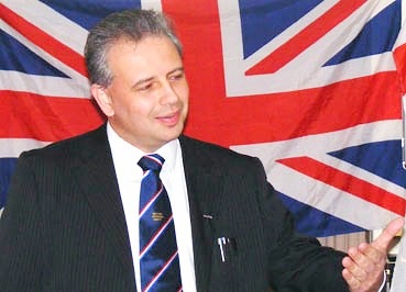 [Martyn Findley in front of flag[4].jpg]