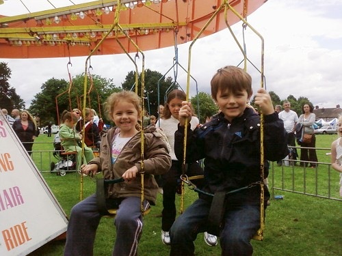 [Aimee and James enjoy roundabout[4].jpg]