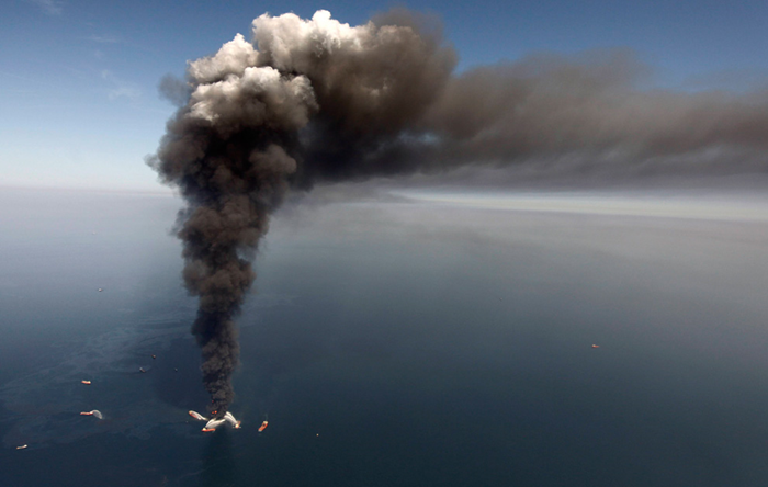 Thick smoke rises above the burning Deepwater Horizon oil rig in the Gulf of Mexico on April 21, 2010. (AP Photo / Gerald Herbert)