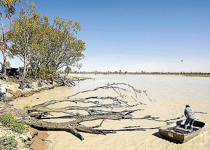 New hope ... Phil Costa and David Hariss walk along the edge of Pamamaroo Lake, which has risen after Boxing Day rains sent much-needed water into the Menindee Lakes system. Photo: Wolter Peeters