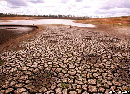 Cracked earth is visible as a result of declining water levels at Wivenhoe Dam in Australia, which supplies Brisbane - the first Australian state capital to be subjected to tighter restrictions, 10 April 2007. BBC