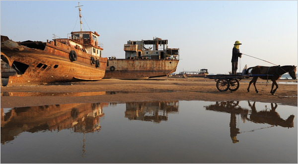 A Cambodian worker transporting sand along the Mekong River. Farmers and fishermen affected by the river&rsquo;s low levels are lashing out at China. Tang Chhin Sothy / Agence France-Presse &mdash; Getty Images