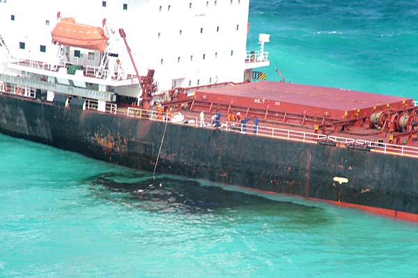 The Chinese bulk coal carrier Shen Neng 1 lies stranded and leaking oil on the Great Barrier Reef. Photo: Maritime Safety Queensland.