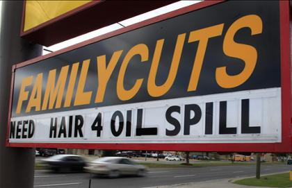A sign calls for hair to be donated at a hair salon in Kenner, La.,Sunday. Engineers announced Saturday they would not be using hair booms to clean up the oil spill. By Charlie Riedel, AP