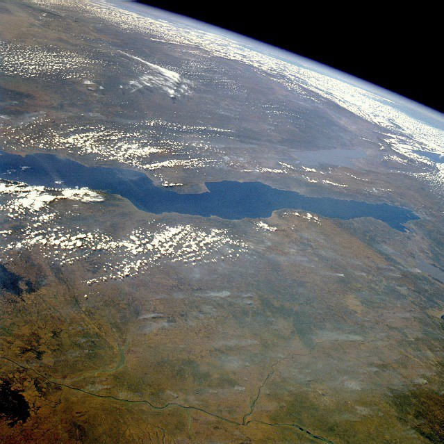 Lake Tanganyika, Tanzania, Zaire, and Zambia June 1985. This east-looking, high-oblique photograph features Lake Tanganyika&mdash;the second deepest freshwater lake in the world with a maximum depth of 4710 feet (1436 meters) and the longest lake in the world, stretching 410 miles (660 kilometers) north to south. Image Science and Analysis Laboratory, NASA-Johnson Space Center